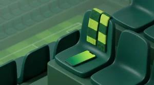 Smartphone und gefalteter Schal auf einer freien Stadiontribüne